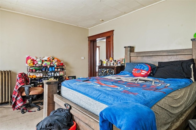 carpeted bedroom featuring crown molding and radiator heating unit