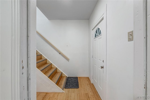 entrance foyer featuring light wood-style flooring and stairs