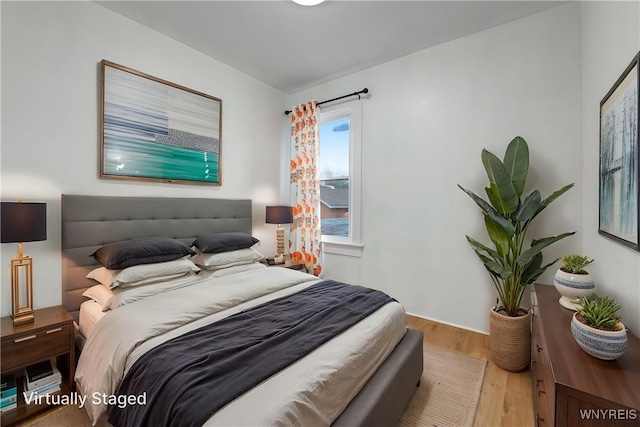 bedroom featuring wood finished floors