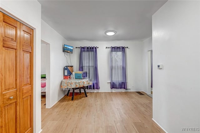 interior space featuring light wood finished floors and visible vents