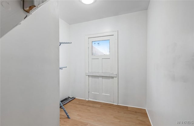 doorway to outside featuring light wood-style floors