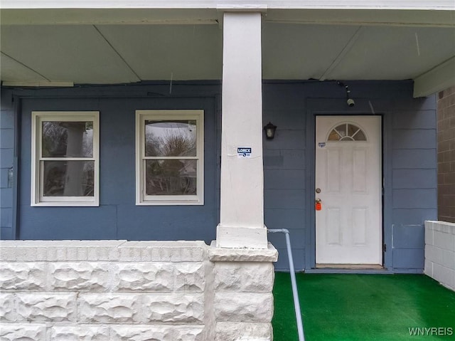 doorway to property with a porch