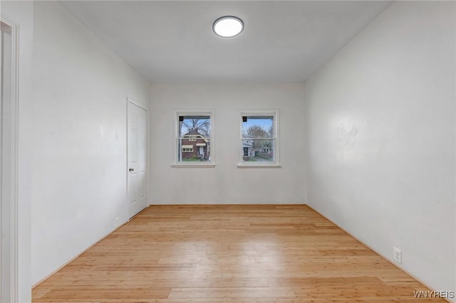 spare room with light wood finished floors