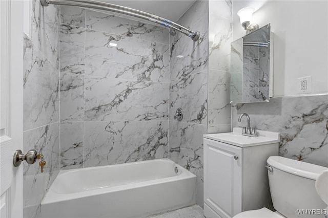 full bath with vanity, toilet, tile walls, and bathtub / shower combination