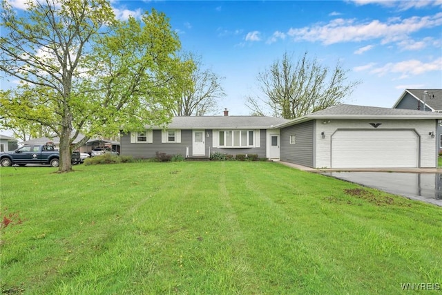 ranch-style house with an attached garage, driveway, and a front yard