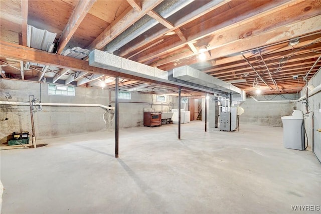 basement with washer / dryer and heating unit