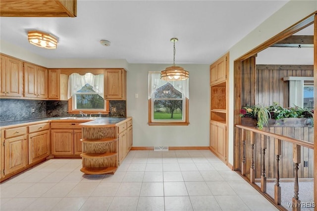 kitchen with open shelves, visible vents, plenty of natural light, and backsplash