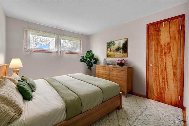 bedroom with light carpet