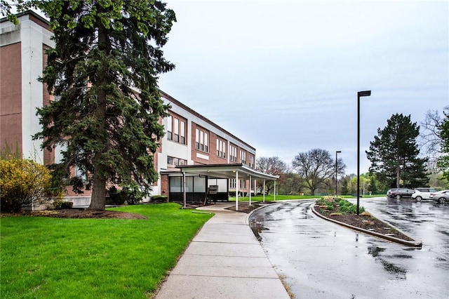 view of home's community featuring a lawn