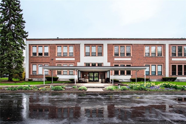 exterior space featuring brick siding