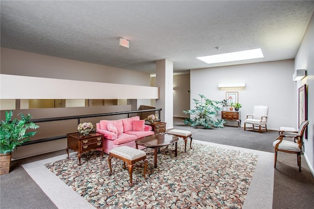 carpeted living room featuring a textured ceiling, baseboards, and a skylight