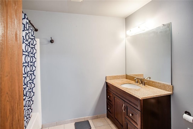 bathroom featuring vanity, shower / bath combination with curtain, and tile patterned floors