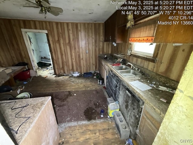 kitchen featuring a ceiling fan and a sink