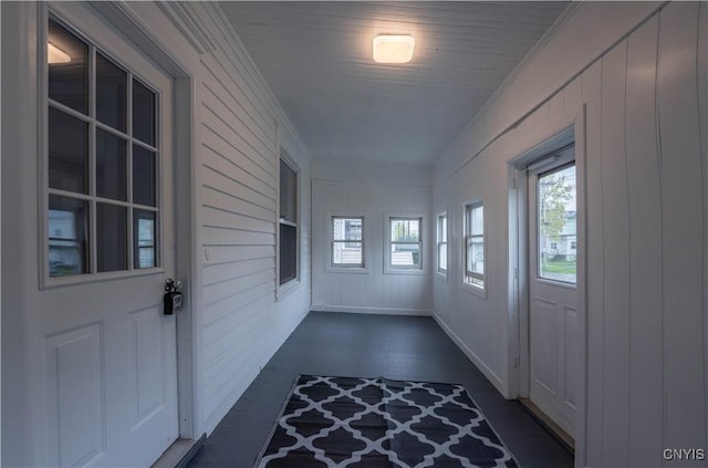 interior space with crown molding and dark wood-style floors