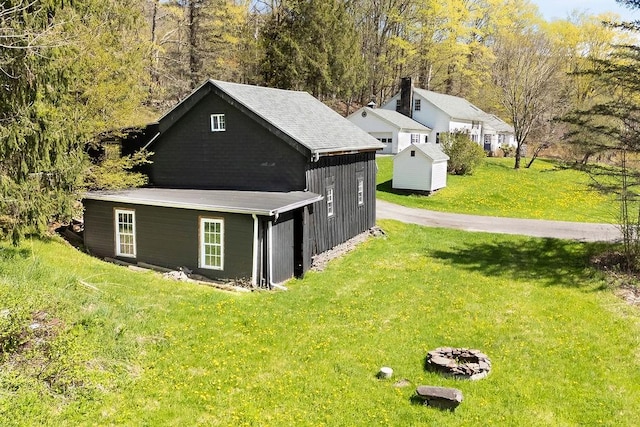 49080 State Highway 30, Roxbury, NY 12474 - view of side of home featuring an outbuilding, a yard, and a storage unit