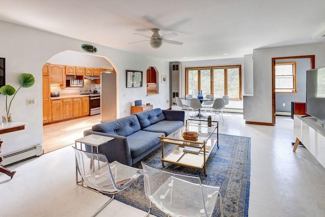 49080 State Highway 30, Roxbury, NY 12474 - living area featuring a baseboard heating unit, arched walkways, ceiling fan, and finished concrete flooring
