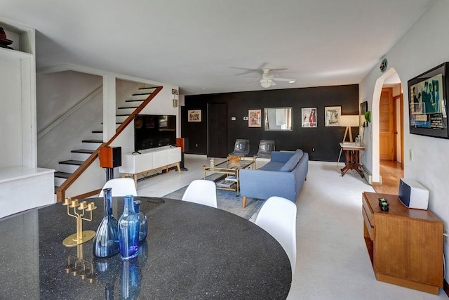 49080 State Highway 30, Roxbury, NY 12474 - living room featuring ceiling fan, stairway, and arched walkways