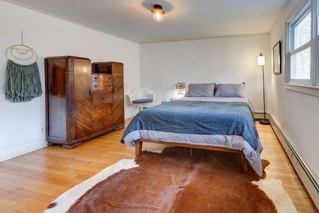 49080 State Highway 30, Roxbury, NY 12474 - bedroom featuring a baseboard radiator, wood finished floors, baseboards, and ornamental molding