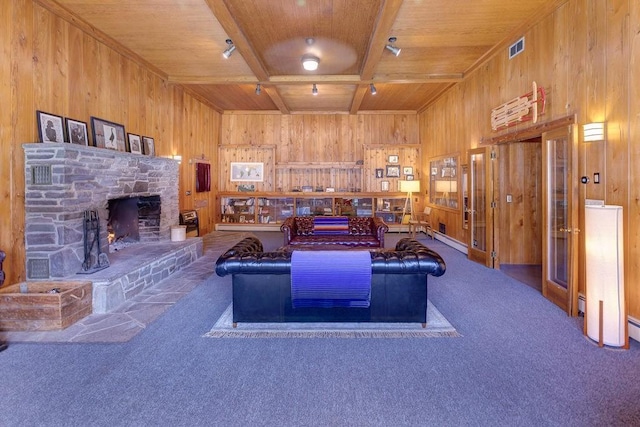 49080 State Highway 30, Roxbury, NY 12474 - carpeted living area with wood walls, wooden ceiling, a fireplace, a baseboard heating unit, and beamed ceiling