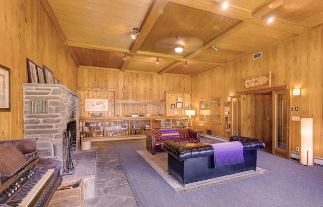 49080 State Highway 30, Roxbury, NY 12474 - living area with wooden ceiling, wooden walls, beamed ceiling, baseboard heating, and a fireplace