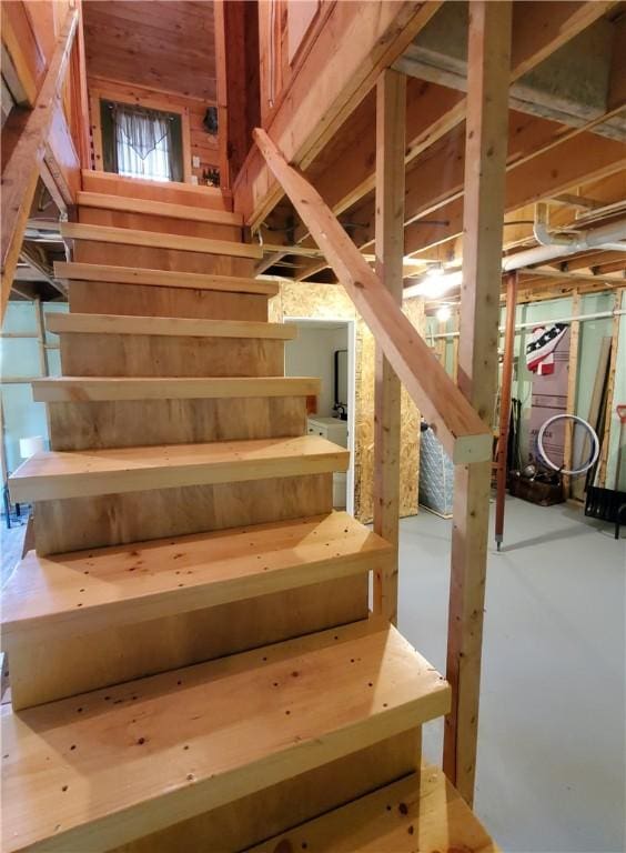 stairs featuring concrete floors