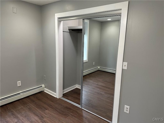 closet with a baseboard heating unit