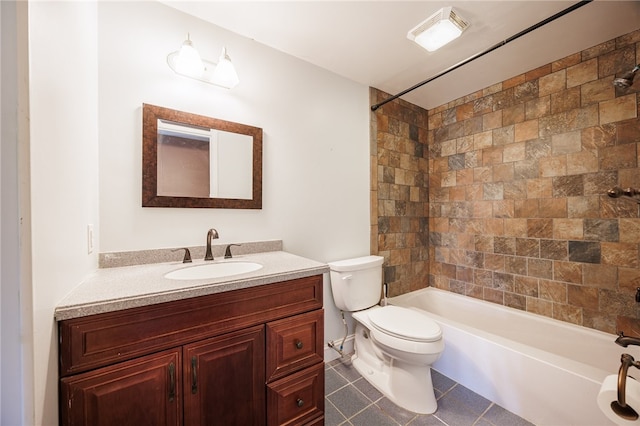 full bath featuring toilet, tile patterned floors, washtub / shower combination, and vanity