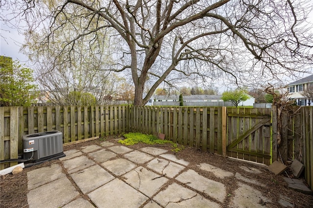 view of patio featuring cooling unit and a fenced backyard