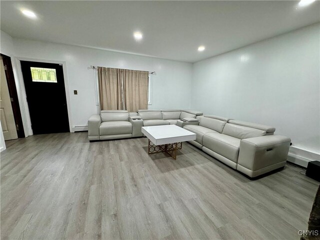 107 Birchwood Ln, Frankfort, NY 13340 - living room with light wood-style floors, a baseboard radiator, and recessed lighting