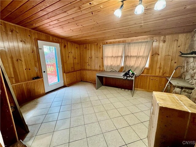 107 Birchwood Ln, Frankfort, NY 13340 - interior space featuring baseboards, wood walls, light tile patterned flooring, and wooden ceiling
