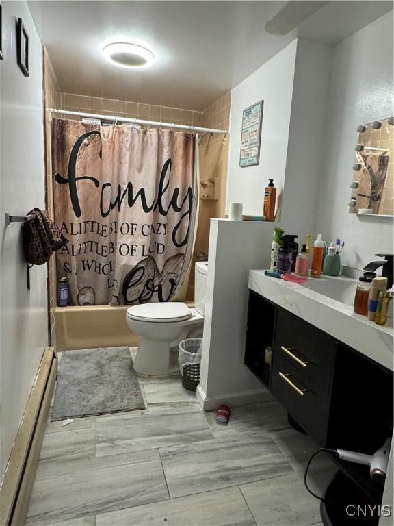 107 Birchwood Ln, Frankfort, NY 13340 - bathroom featuring a baseboard radiator, toilet, shower / tub combo, and vanity