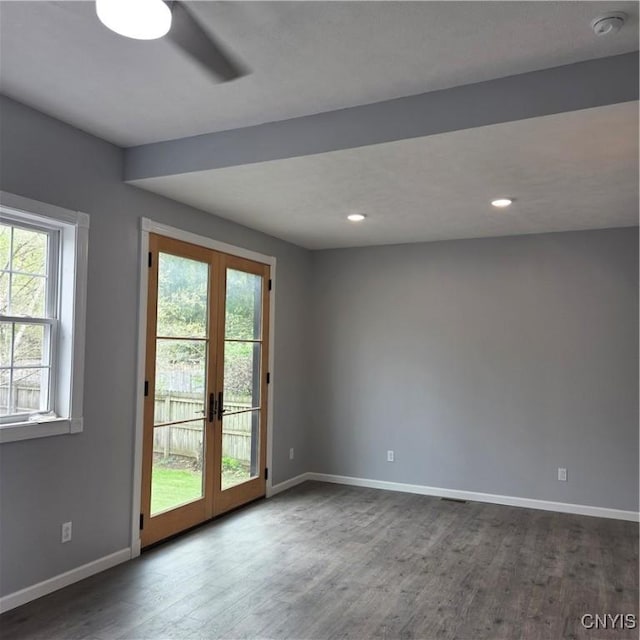 interior space featuring baseboards, dark wood-style flooring, and french doors