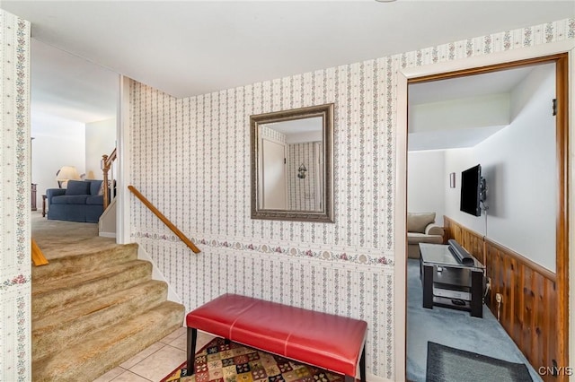 interior space featuring a wainscoted wall and wallpapered walls