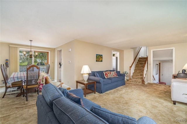 carpeted living area featuring stairs and a notable chandelier