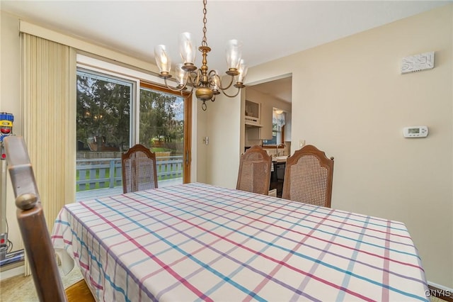 dining area featuring an inviting chandelier