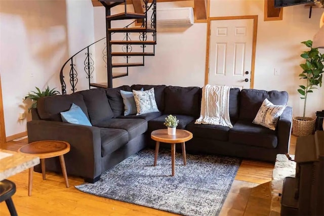 7136 Maples Rd, Mansfield, NY 14755 - living area featuring stairs, a wall mounted air conditioner, and wood finished floors