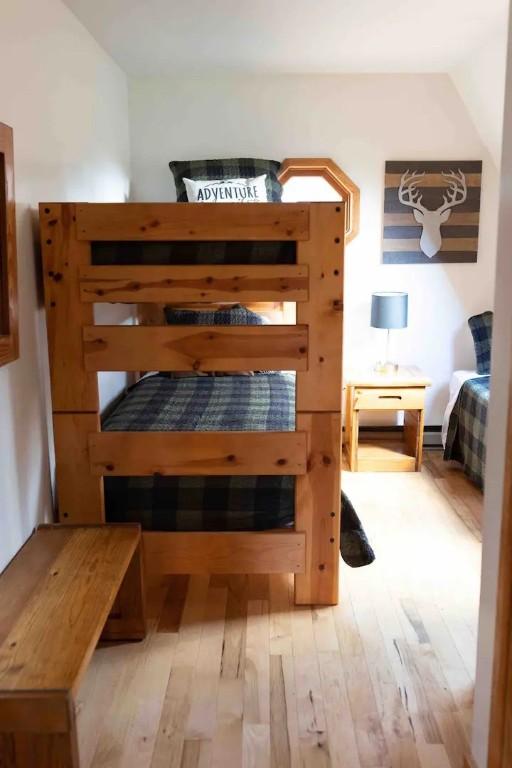 7136 Maples Rd, Mansfield, NY 14755 - unfurnished bedroom featuring a baseboard radiator and light wood-style flooring