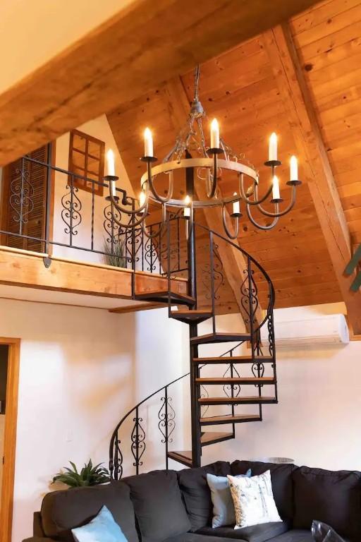 7136 Maples Rd, Mansfield, NY 14755 - stairway featuring wooden ceiling, a chandelier, and beamed ceiling