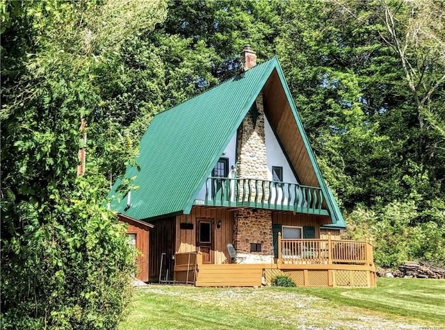 7136 Maples Rd, Mansfield, NY 14755 - rear view of property with a deck, stone siding, a yard, metal roof, and a chimney