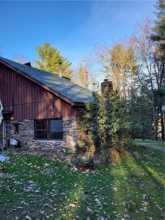 607 Kilkenny Rd, Unadilla, NY 13849 - view of side of home featuring stone siding and a chimney