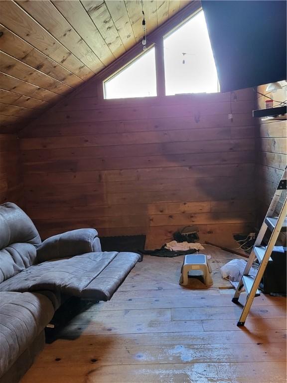 607 Kilkenny Rd, Unadilla, NY 13849 - interior space with vaulted ceiling, hardwood / wood-style flooring, wooden ceiling, and wooden walls