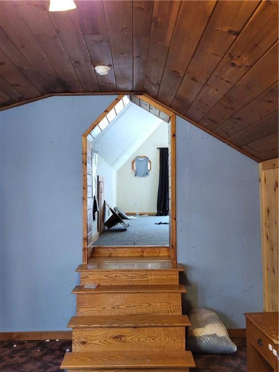 607 Kilkenny Rd, Unadilla, NY 13849 - stairway with wooden ceiling and vaulted ceiling