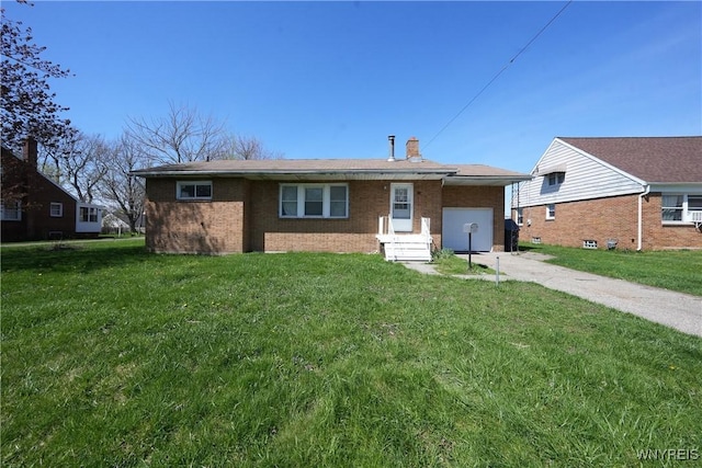 view of front facade featuring an attached garage, concrete driveway, brick siding, and a front lawn