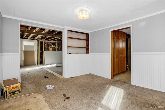 spare room featuring wainscoting