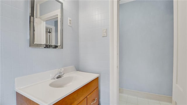 bathroom with baseboards and vanity