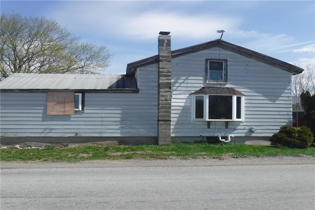 9867 Transit Rd, Pavilion, NY 14054 - view of side of property featuring a chimney