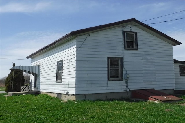 9867 Transit Rd, Pavilion, NY 14054 - view of home's exterior featuring a yard