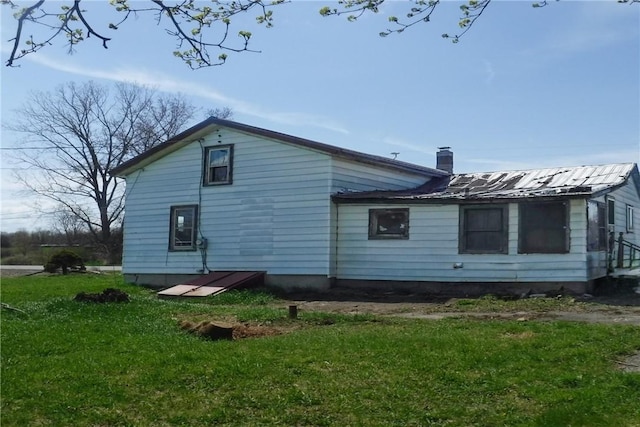 9867 Transit Rd, Pavilion, NY 14054 - back of house featuring a yard and a chimney