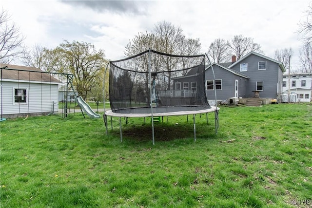 108 Mechanic St, Antwerp, NY 13608 - view of yard featuring central air condition unit, a trampoline, and a playground