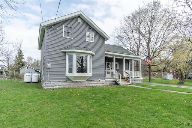 108 Mechanic St, Antwerp, NY 13608 - traditional-style house featuring a porch, a shingled roof, and a front lawn